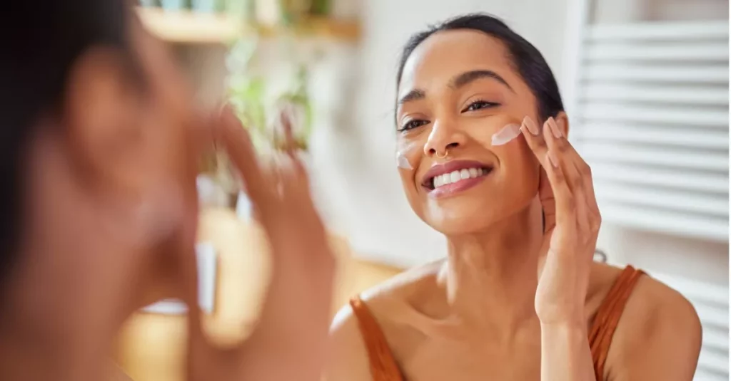 woman applying anti aging cream on her face